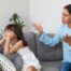 Girl ignoring her mom's instructions and mom showing frustration